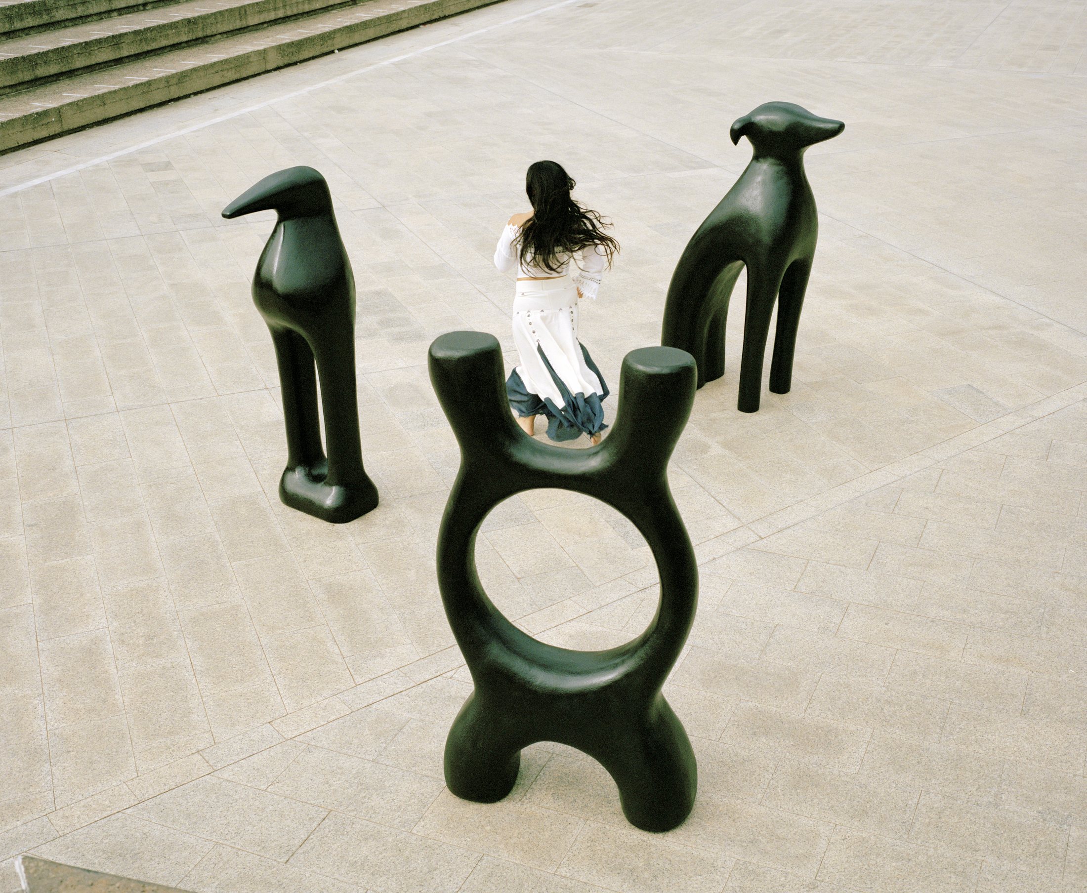 Overhead image of dark sculptural forms around BLUEM.